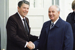 Soviet Leader Mikhail Gorbachev, second from right, and U.S. Pres. Ronald Reagan, second from left, shake hands outside the Hofdi at the start of a series of talks, Saturday, Oct. 11, 1986, Reykjavik, Iceland. The other men are unidentified. (AP Photo/Ron Edmonds)